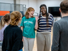 An image of participants having a laugh on the Red Grit Course