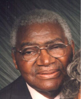 Francis Martin in a suit with grey hair and glasses