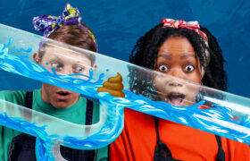 Two people behind an animated transparent pipe with a poo floating down it